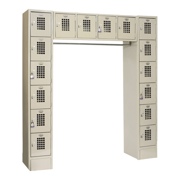 A white Winholt metal locker with 16 compartments.