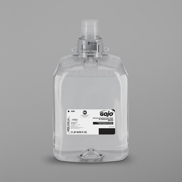 A clear plastic bottle of GOJO Fragrance Free Foaming Hand Soap with a black and white label.