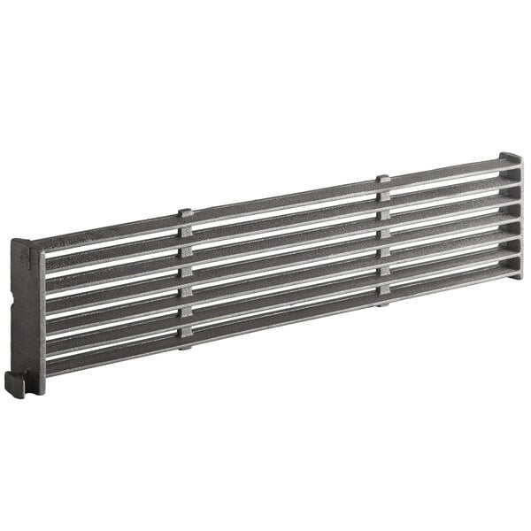 A stainless steel metal grate with a metal bar with many horizontal lines.
