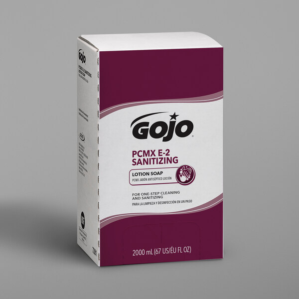 A white box with a purple label for GOJO TDX E2 Sanitizing Lotion Hand Soap.