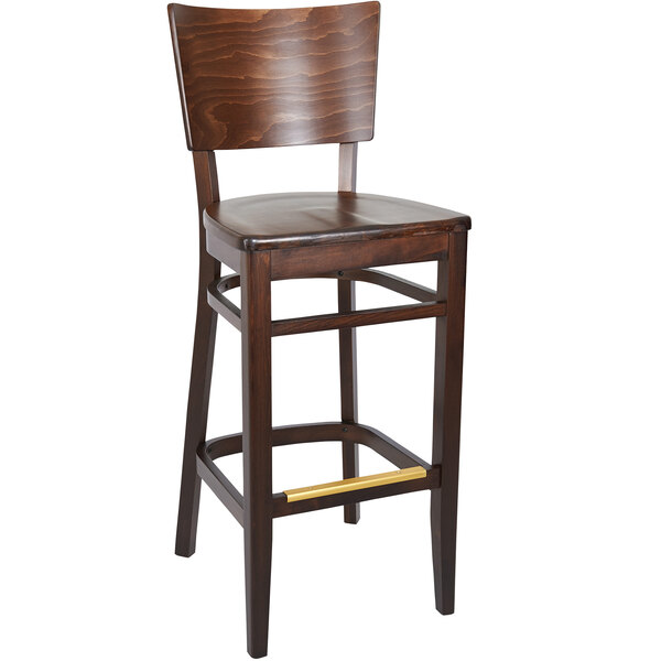 A BFM Seating Aston dark walnut beechwood barstool with a cushioned gold seat and backrest.