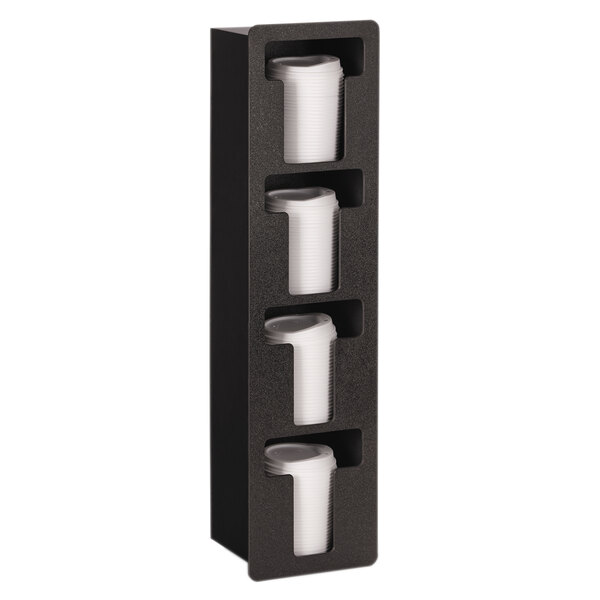 A black wall mounted Vollrath lid holder with four slots holding white plastic cups.