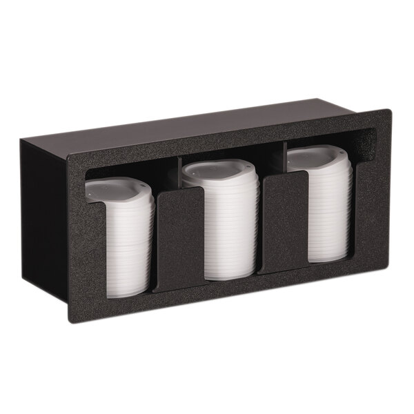 A black Vollrath lid holder with white plastic cups inside.