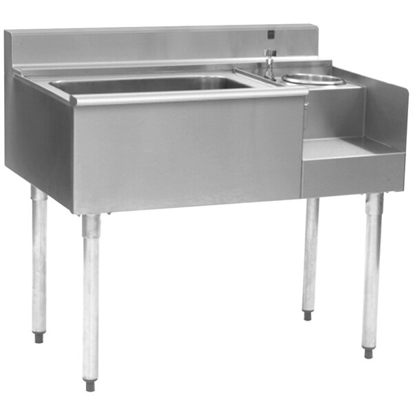 A stainless steel Eagle Group underbar blender module with a center ice bin, left bottle holders, and a cold plate.