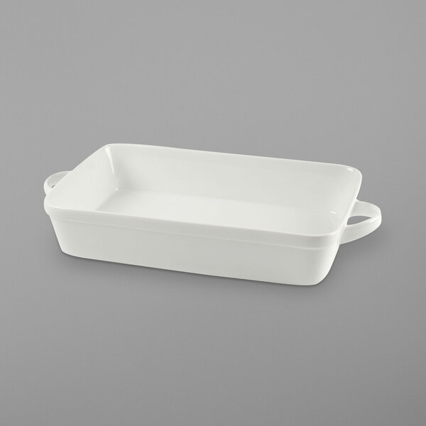 A white rectangular porcelain baker with two handles.