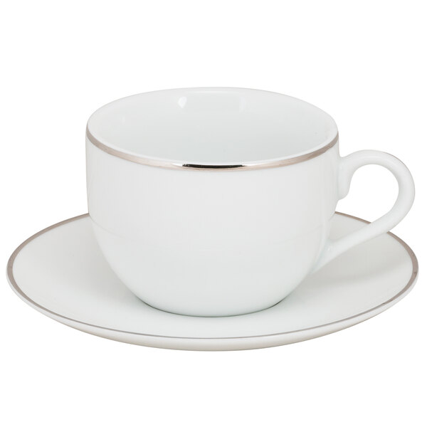 A 10 Strawberry Street white porcelain coffee cup and saucer with silver rim.