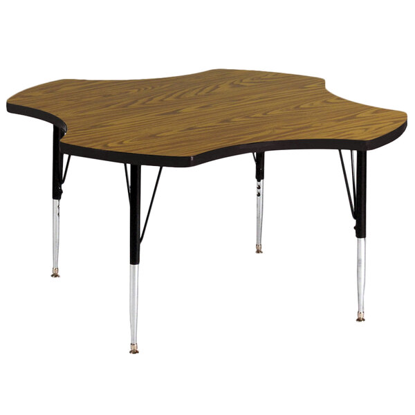 A Correll activity table with a wooden surface and metal base.