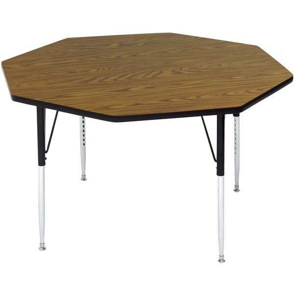 A wooden Correll activity table with metal legs and an octagonal top.