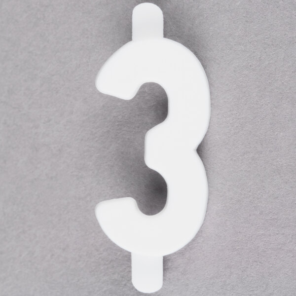 A white number three on a gray surface with "Ketchum Manufacturing 3/4" White Molded Plastic Number 3 Deli Tag Insert"