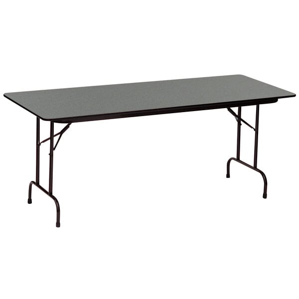 A rectangular Correll folding table with a black Montana granite finish.
