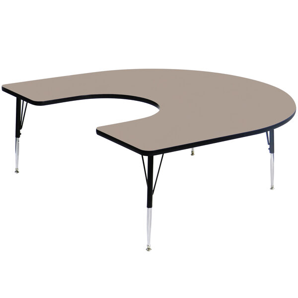 A Correll horseshoe-shaped activity table with an adjustable height and a high-pressure laminate top.