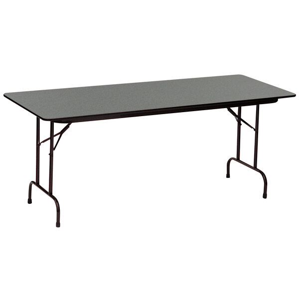 A black rectangular Correll folding table with metal legs and a Montana Granite finish.