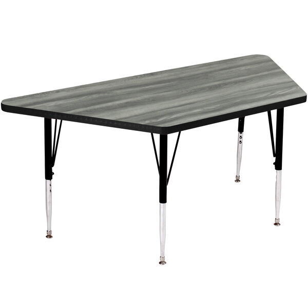 A rectangular Correll New England driftwood trapezoid activity table with black legs.