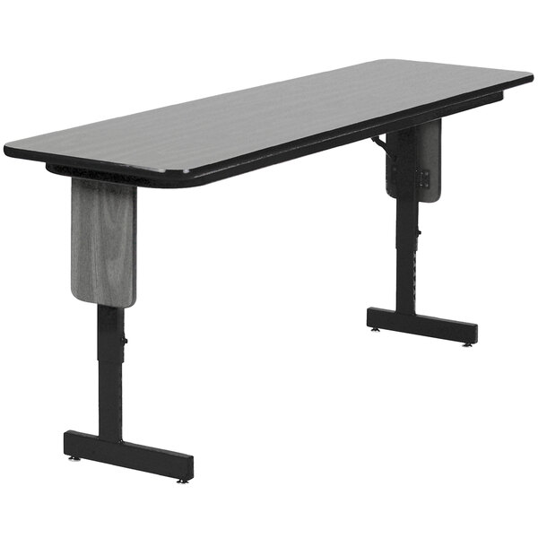 A black and gray rectangular Correll seminar table with panel legs.