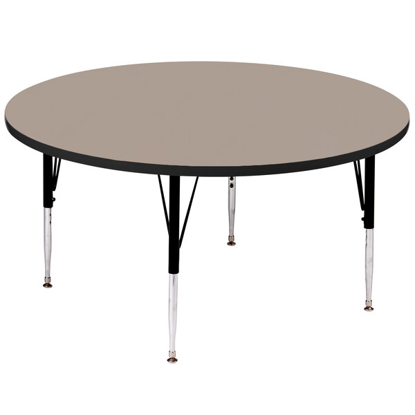 A Correll round activity table with black legs and a black top.