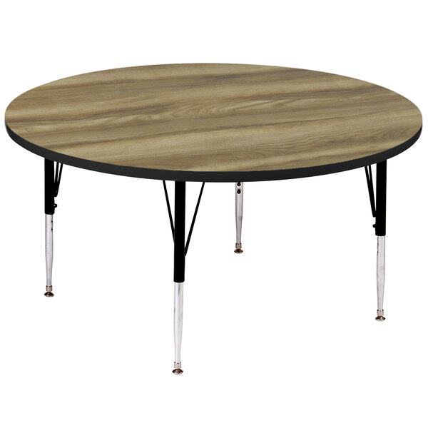 A Correll round activity table with black legs and a wood top.
