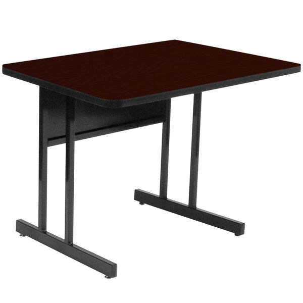 A rectangular table with black legs and a mahogany top.