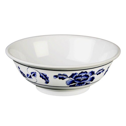 A white melamine bowl with blue flowers on it.