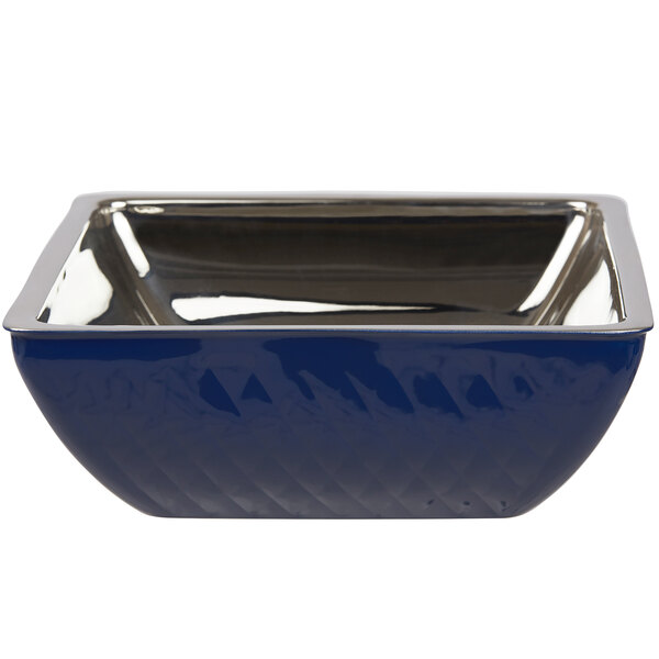 A Bon Chef cobalt blue square bowl with silver trim.