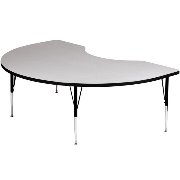 A white table with a black frame and silver legs.
