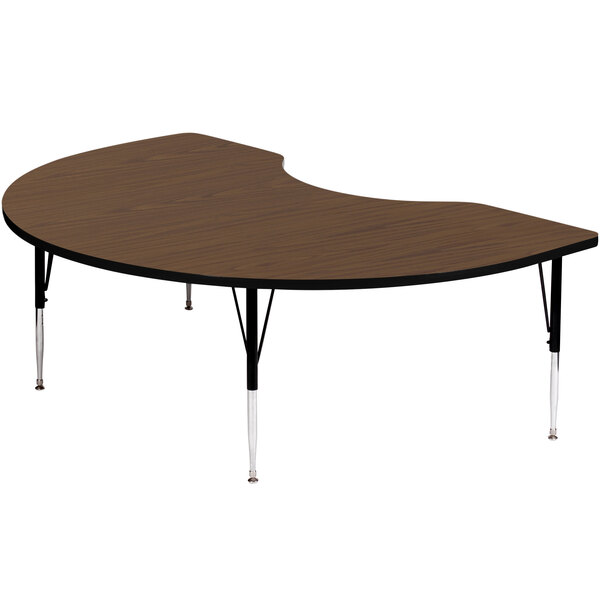 A Correll walnut-finish kidney-shaped activity table with adjustable legs.