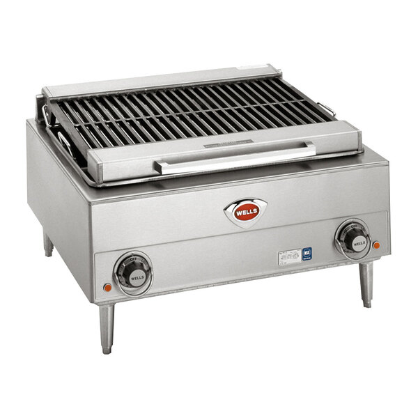 A Wells stainless steel electric charbroiler with two control knobs on a counter.