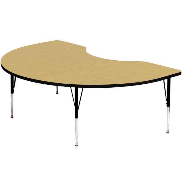 A Correll kidney-shaped activity table with adjustable legs.