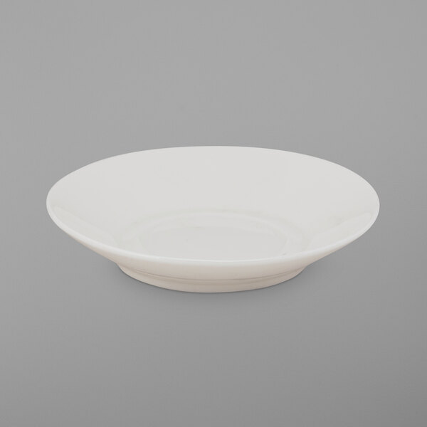 A white porcelain saucer with a small rim.