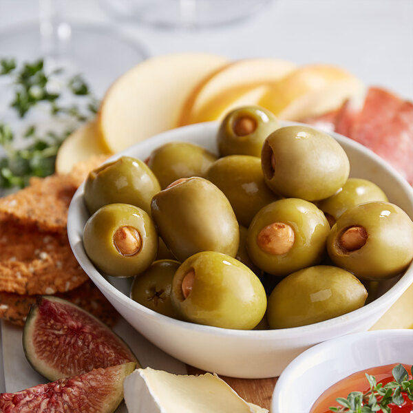A bowl of Belosa hickory-smoked almond stuffed green olives.