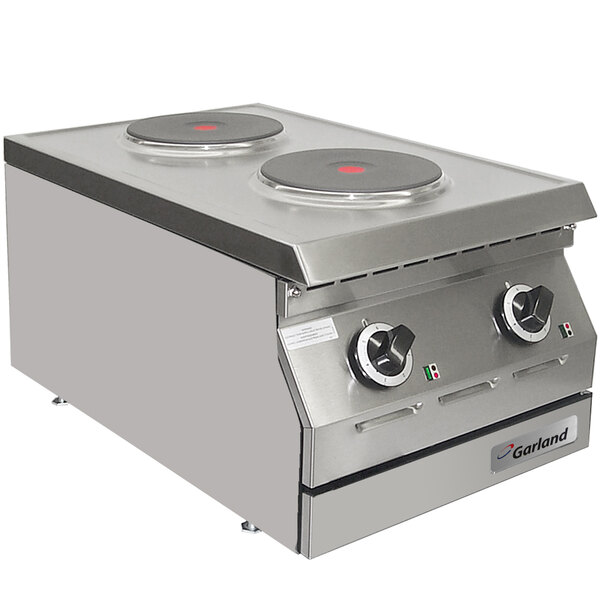 A Garland stainless steel countertop hot plate with two solid burners.