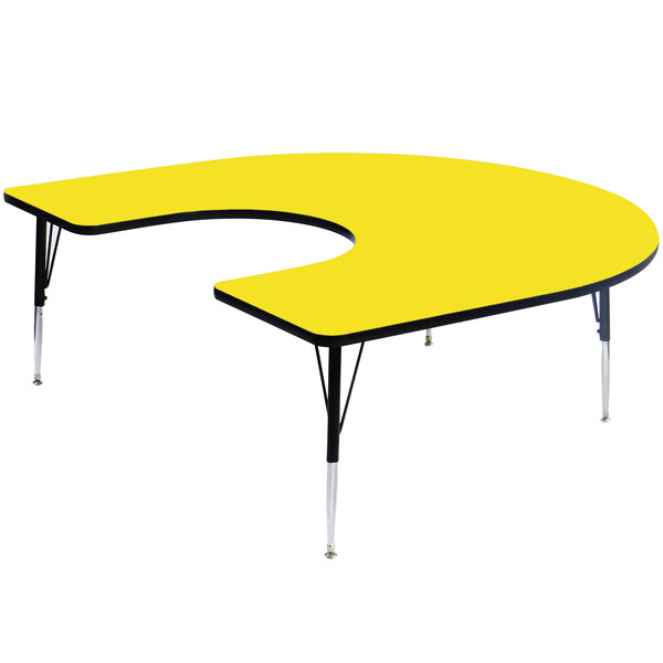 A yellow table with a horseshoe-shaped high-pressure top and black frame.