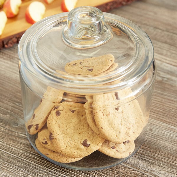 An Anchor Hocking glass jar with cookies inside and a lid.