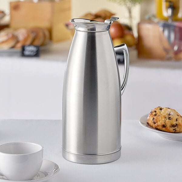 A Choice stainless steel thermal carafe on a table.