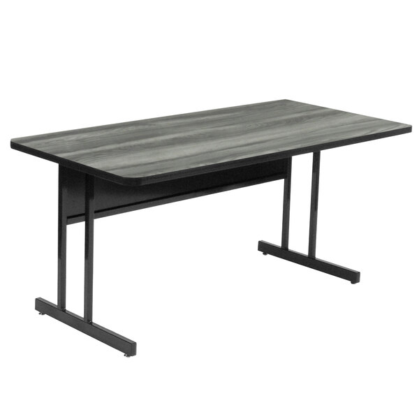 A black rectangular table with metal legs and a grey top.
