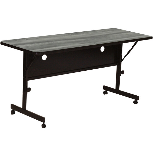 A rectangular grey Correll seminar table with wheels.