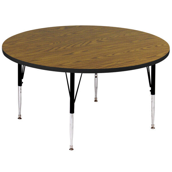 A Correll round activity table with black legs.