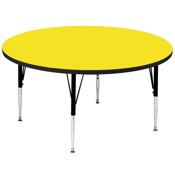 A yellow Correll round activity table with black legs.