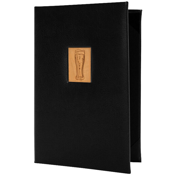 A black menu cover with a wood inlay holding a menu with a wooden glass on it.