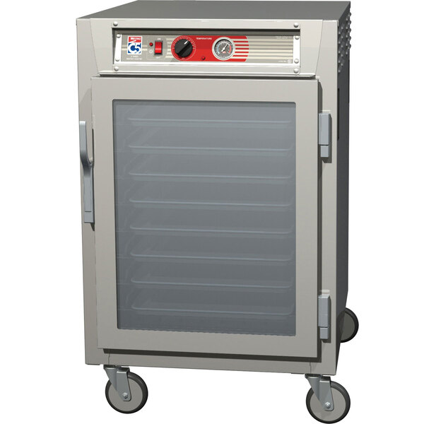 A white Metro C5 half-height heated holding cabinet with clear and solid doors.