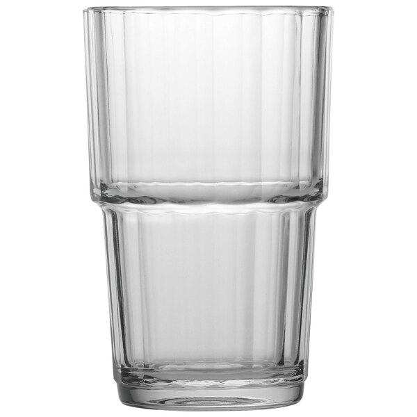 An Arcoroc clear glass highball with a rim.