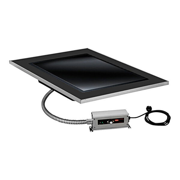 An Eastern Tabletop grey grain drop-in hot plate tile with a black rectangular electronic device attached to it.