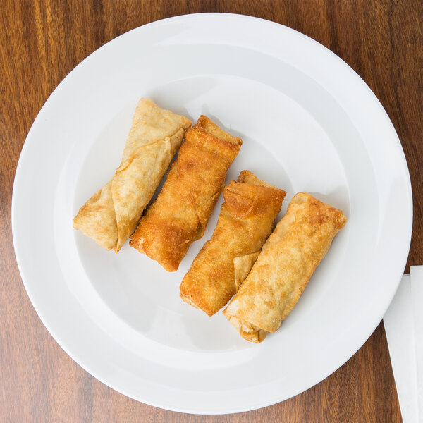 Fried spring rolls on a white Arcoroc side plate.
