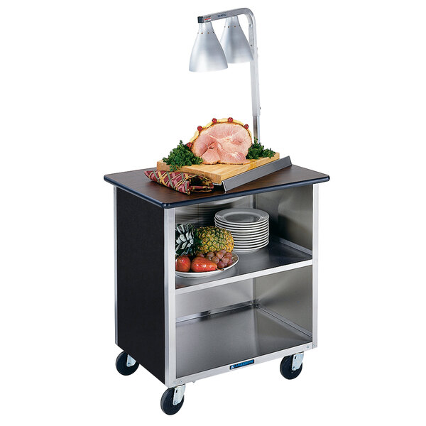 A Lakeside stainless steel utility cart with shelves holding food.