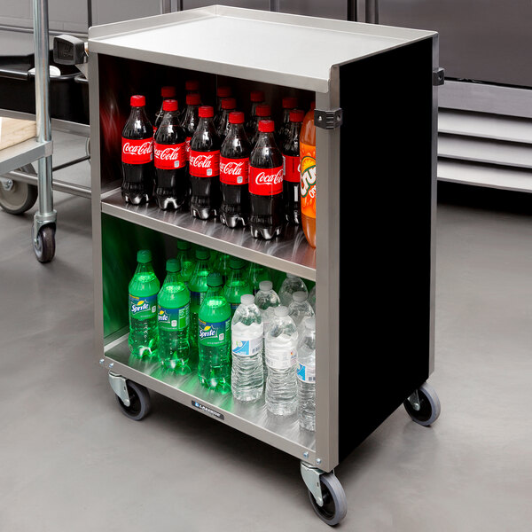 A black Lakeside utility cart with bottles of soda and soft drinks on a shelf.