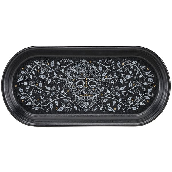 A black Fiesta bread tray with a skull and vine design on it.