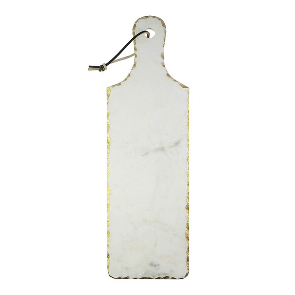 An American Atelier white marble cutting board with a gold handle.
