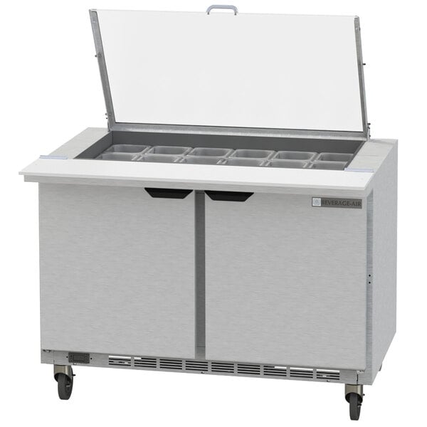 A Beverage-Air stainless steel sandwich prep table with 4 drawers and clear lids.