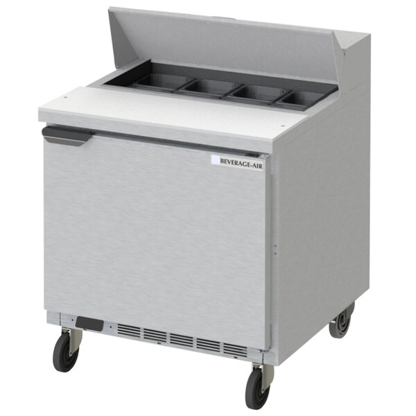 A Beverage-Air stainless steel refrigerator with an open door on a counter.