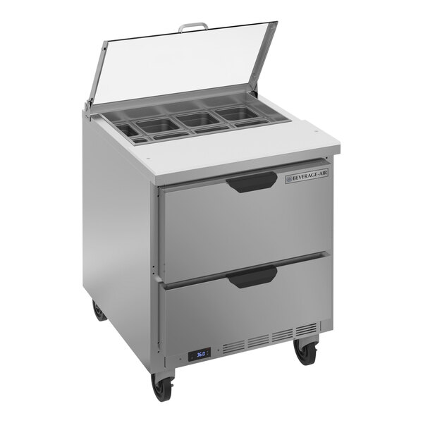 A stainless steel Beverage-Air refrigerated sandwich prep table with two drawers and a clear lid.