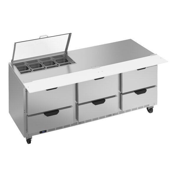 A large stainless steel counter with 6 drawers.